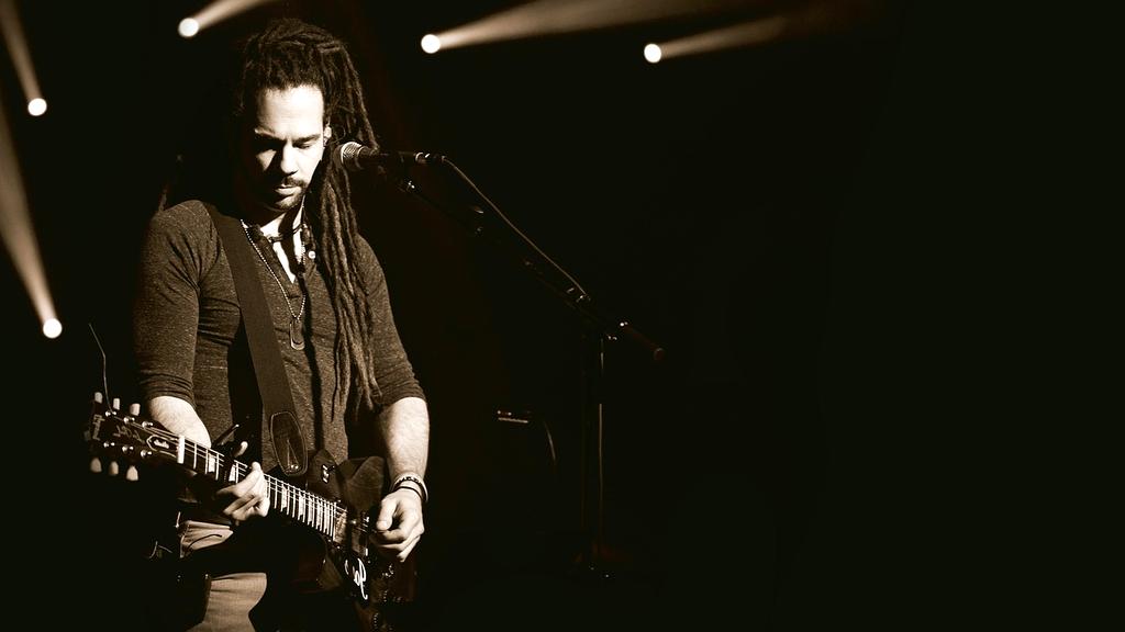 Rock band Crimson Thunder performing energetic concert with stage pyrotechnics