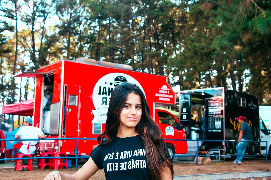Colorful food trucks and outdoor dining area at festival