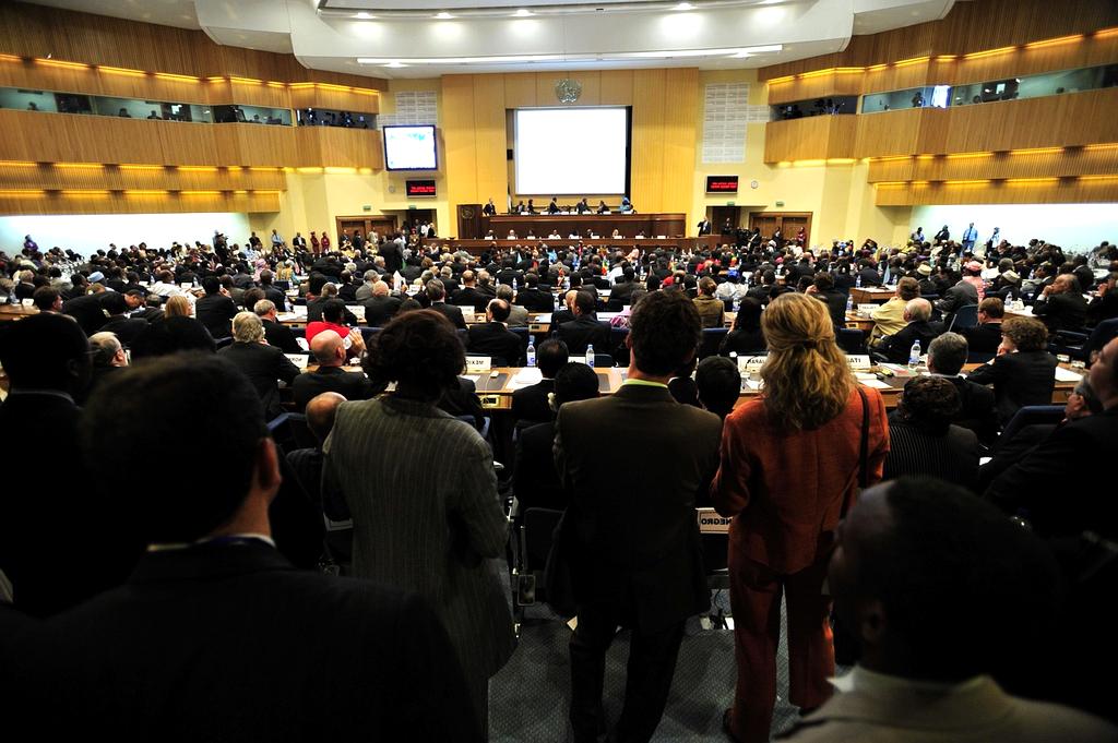 Modern conference hall with tech presentation on large screen