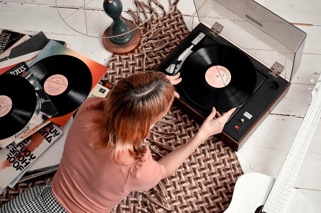 Vintage vinyl record spinning on turntable with warm lighting